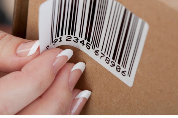 cardboard box with a plastic label on it.