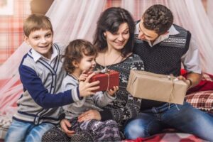 A family giving each other gifts